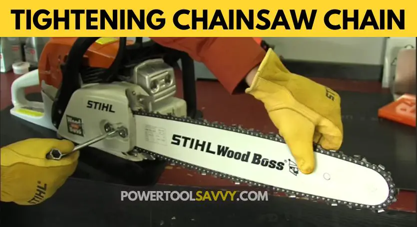 Tightening chainsaw chain while holding the bar up.