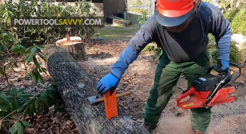 Getting chainsaw out with wedges - Step 3