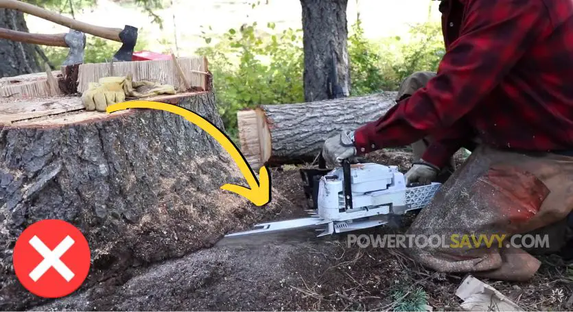 chainsaw hitting the dirt