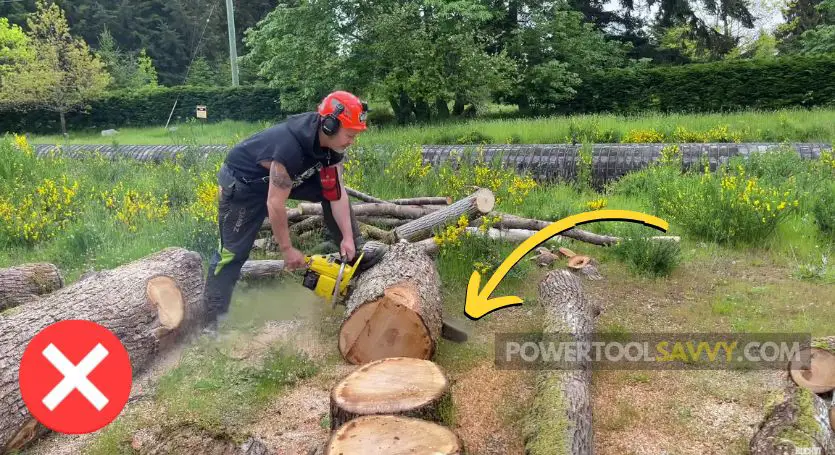 chainsaw touching the ground