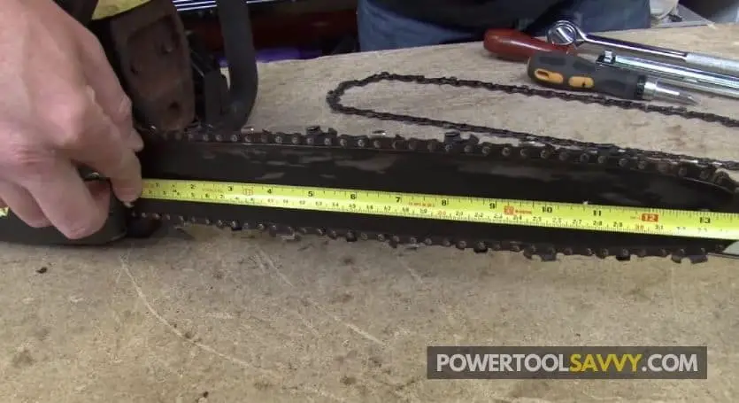 measuring the length of a chainsaw bar